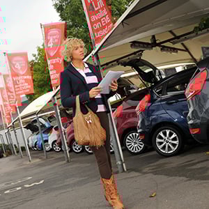 Woman-car-dealership-forecourt-fleet-news