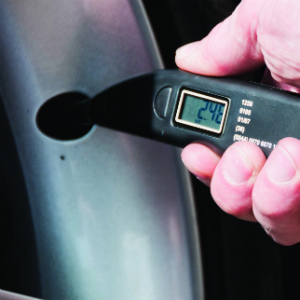 Digital tyre pressure gauge in use
