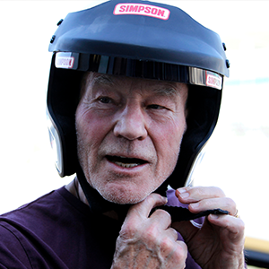 Sir Patrick Stewart revving up to race at the Silverstone Classic