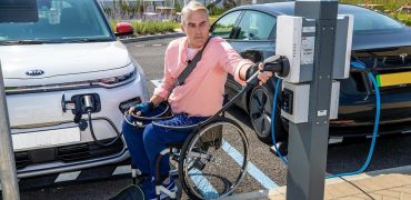 Man in wheelchair at charging point