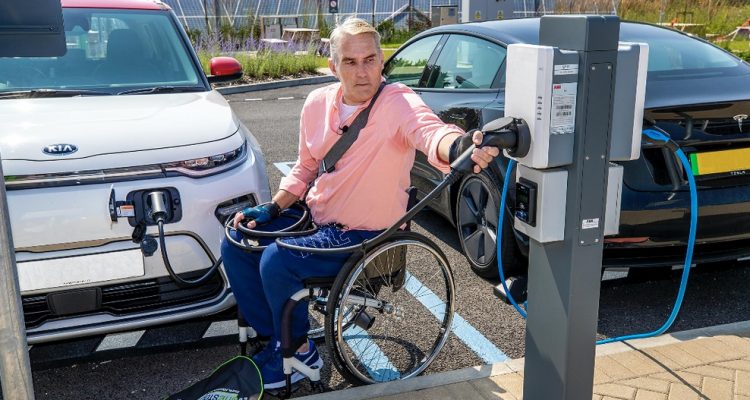 Man in wheelchair at charging point