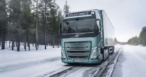 Electric Volvo truck driving in snow
