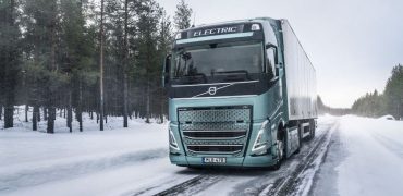 Electric Volvo truck driving in snow