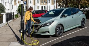 Woman using on-street charging point