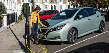Woman using on-street charging point