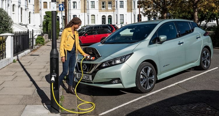 Woman using on-street charging point