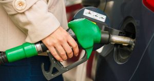 Woman Fueling A Car