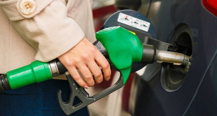 Woman Fueling A Car