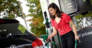 Woman filling up her car