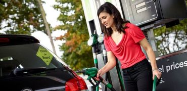 Woman filling up her car