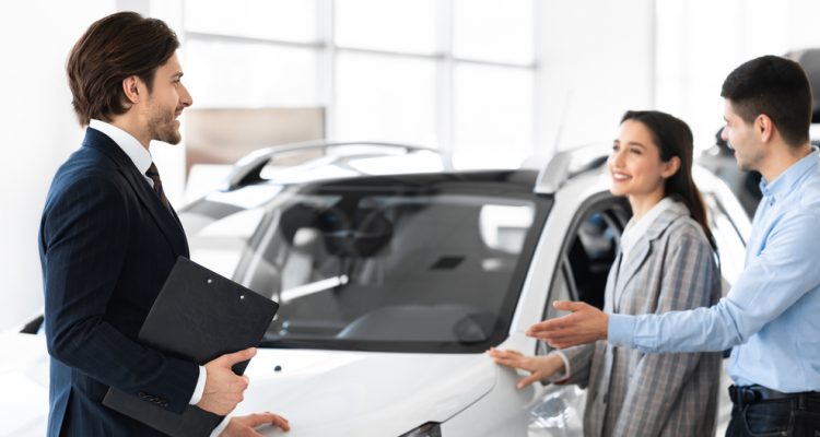 Man and woman purchasing a car