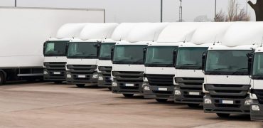 Company,Fleet,Of,Commercial,Lorries,Parked,In,A,Row,Ready