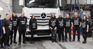 Employees at Sparshatt Truck & Van wearing t-shirts with inspirational quotes at their Sittingbourne depot.