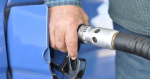 A person refuelling a car