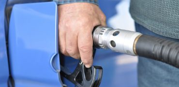A person refuelling a car