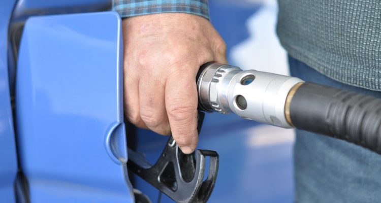 A person refuelling a car