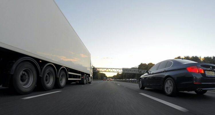 Car overtaking an HGV on the motorway