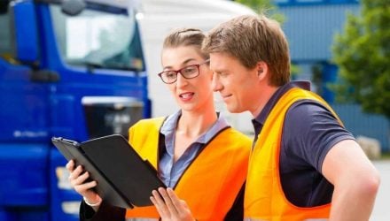 HGVC trainee and Instructor looking at an app