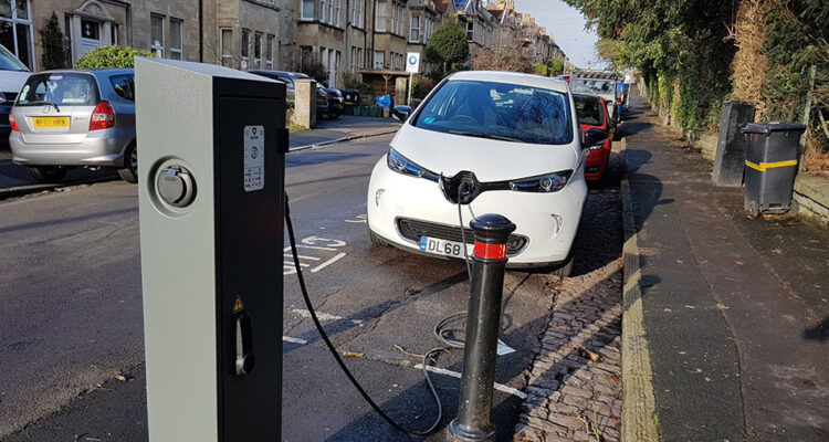White electric car using a public charging point