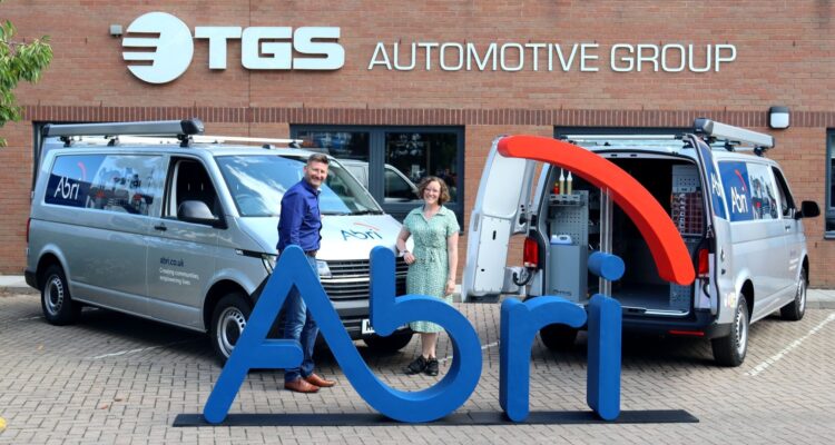 Abri with two of their new vans