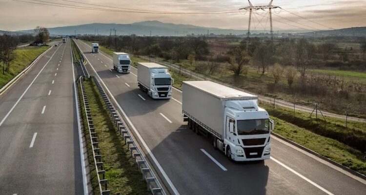 Fleet of trucks on a motorway