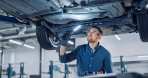 Inspecting the underside of a car