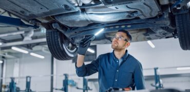 Inspecting the underside of a car