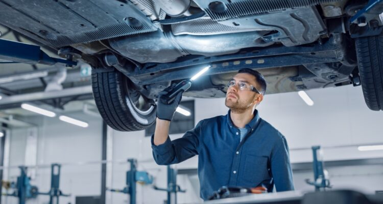 Inspecting the underside of a car