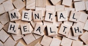 Scrabble tiles spelling out Mental Health
