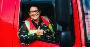 Female HGV driver giving a thumbs up