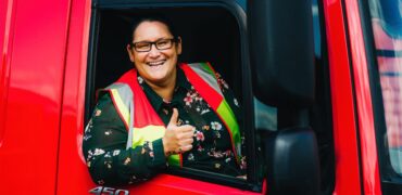 Female HGV driver giving a thumbs up