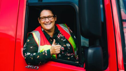 Female HGV driver giving a thumbs up