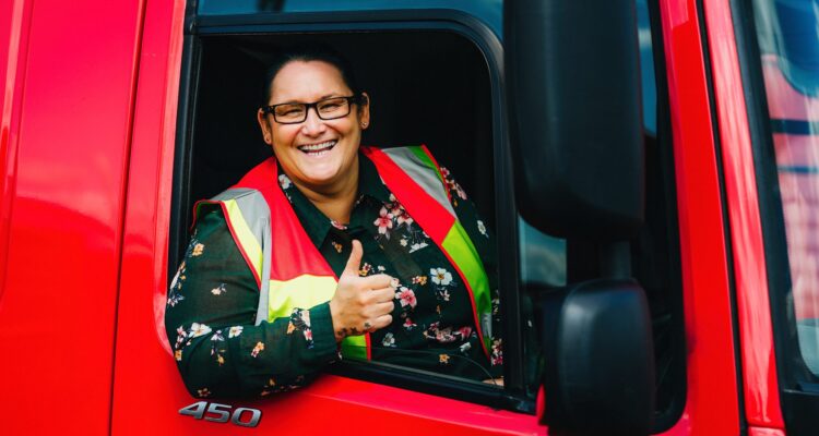 Female HGV driver giving a thumbs up