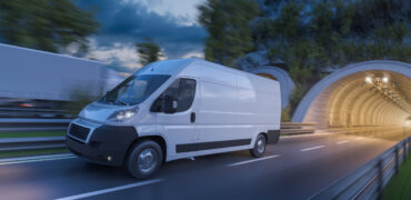 Image of tunnels and commercial vehicles in motion at dark