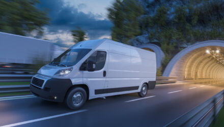 Image of tunnels and commercial vehicles in motion at dark