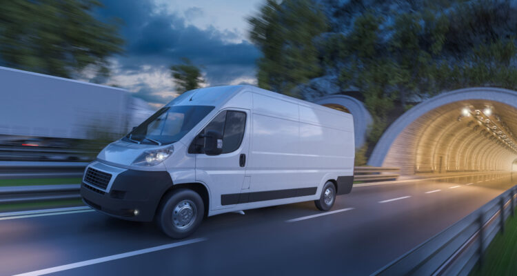 Image of tunnels and commercial vehicles in motion at dark