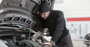 Mechanic checking vehicles