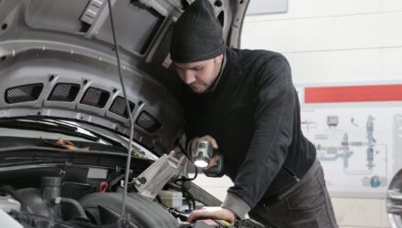 Mechanic checking vehicles