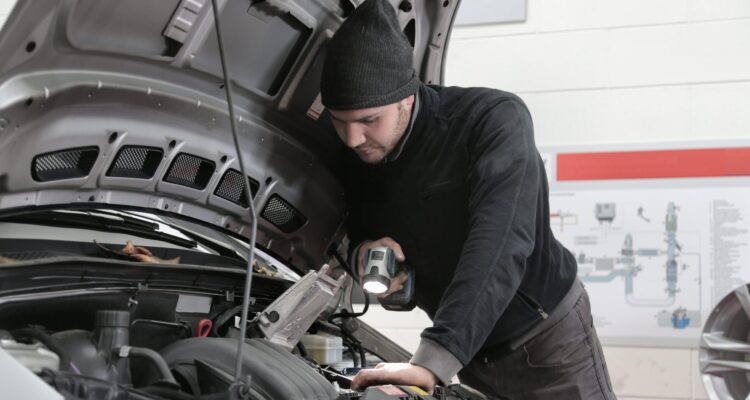 Mechanic checking vehicles