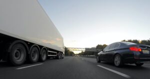 Car overtaking a lorry, road safety