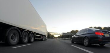 Car overtaking a lorry, road safety