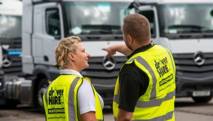 Two Driver Hire employees discussing HGVs