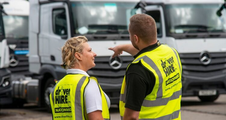 Two Driver Hire employees discussing HGVs