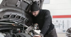 Mechanic checking vehicles