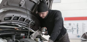 Mechanic checking vehicles