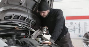 Mechanic inspecting a car engine