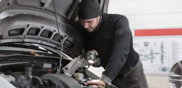 Mechanic inspecting a car engine