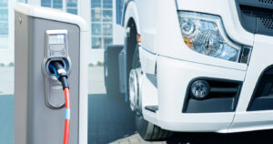 Electric vehicles charging station on a background of a truck