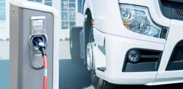 Electric vehicles charging station on a background of a truck