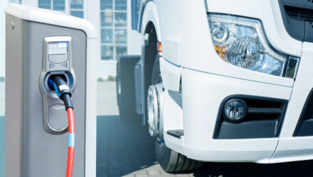 Electric vehicles charging station on a background of a truck